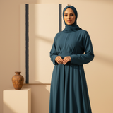 Portrait of Nadia El-Fadel, a woman with warm features, wearing a MOONQADIR garment with a refined modern silhouette, looking