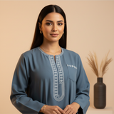 Portrait of influencer Amira J., a woman with dark hair, looking confidently at the viewer against a cream background.